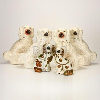 Appraisal: STAFFORDSHIRE Six porcelain Spaniels Stafford England late- th c Unmarked