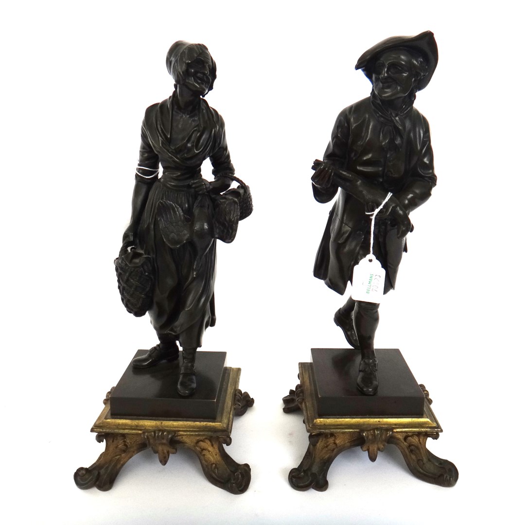 Appraisal: A pair of French bronze figures of street vendors th