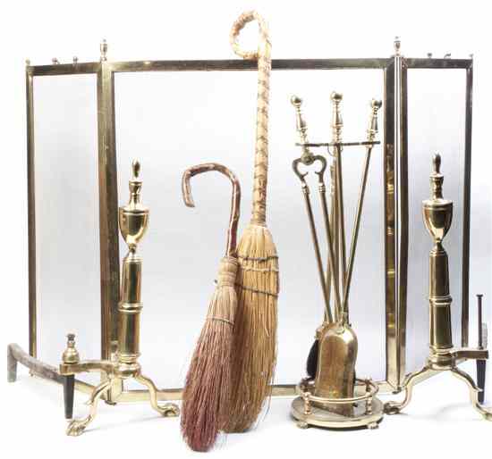 Appraisal: A Set of Brass Fireplace Equipment comprising two firescreens two