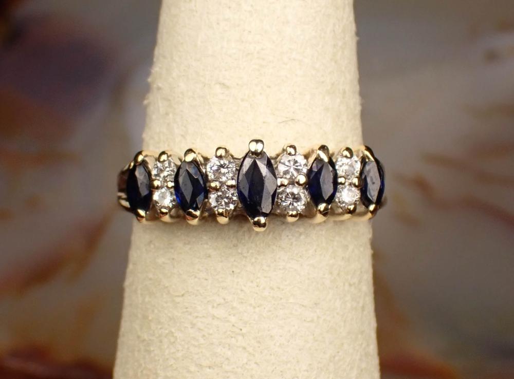 Appraisal: SAPPHIRE DIAMOND AND FOURTEEN KARAT GOLD RING The yellow gold