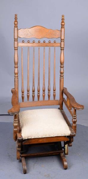 Appraisal: Early Glider Rocking Chair This oak stick and ball style