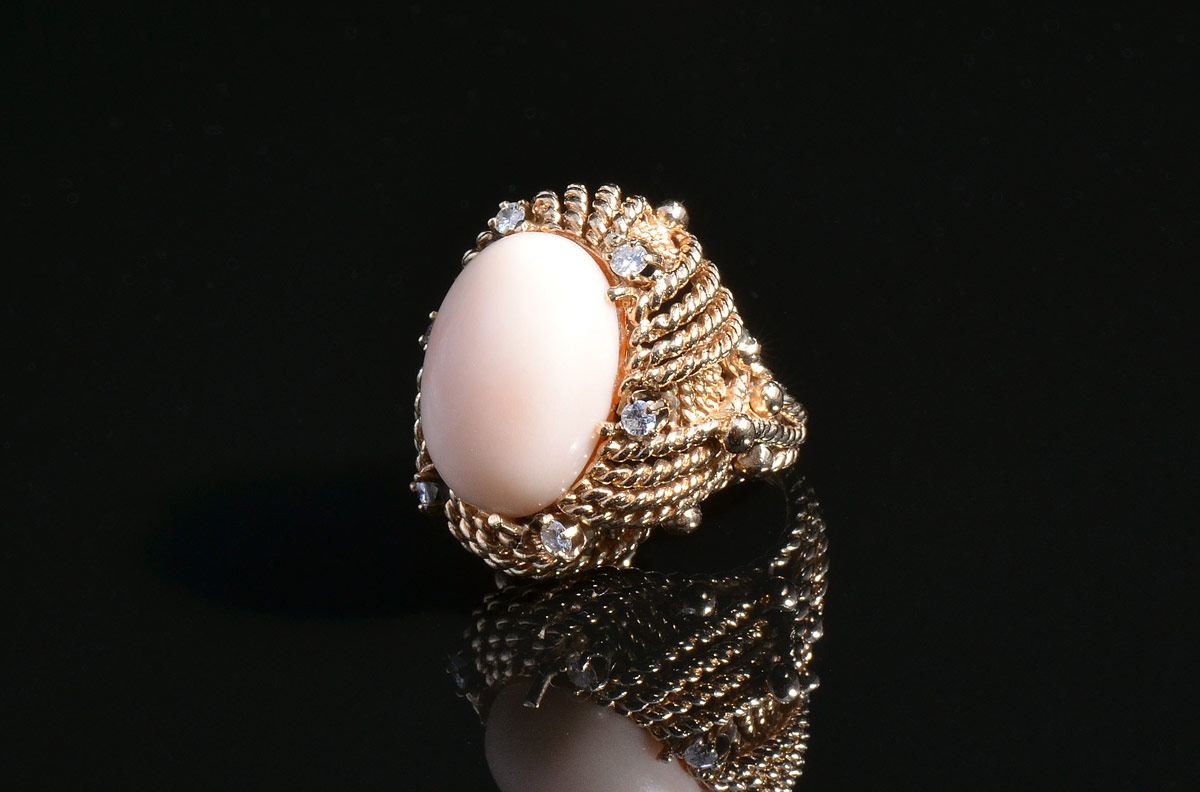 Appraisal: K GOLD CORAL DIAMOND RING Centering a cabochon pink coral