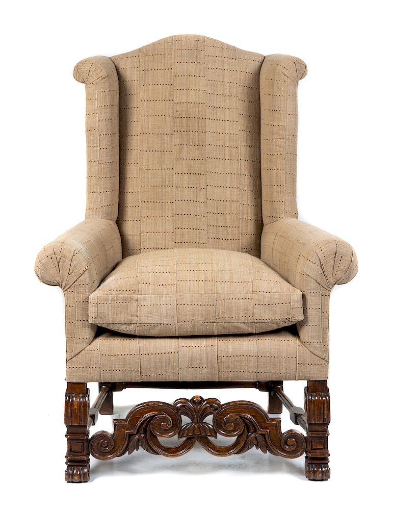 Appraisal: A Jacobean Style Oak Wingback Armchair A Jacobean Style Oak