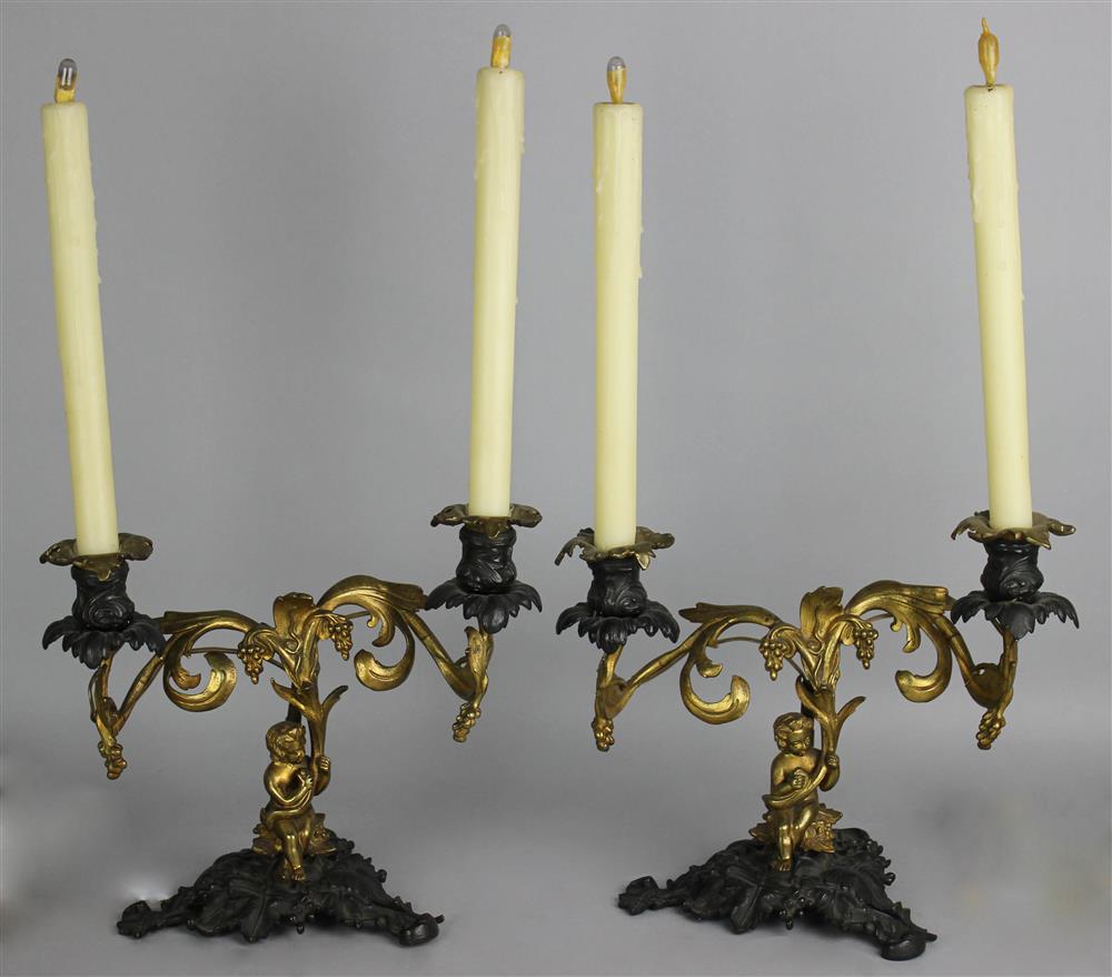 Appraisal: PAIR OF CONTINENTAL GILT AND PATINATED BRONZE FIGURAL TWO LIGHT