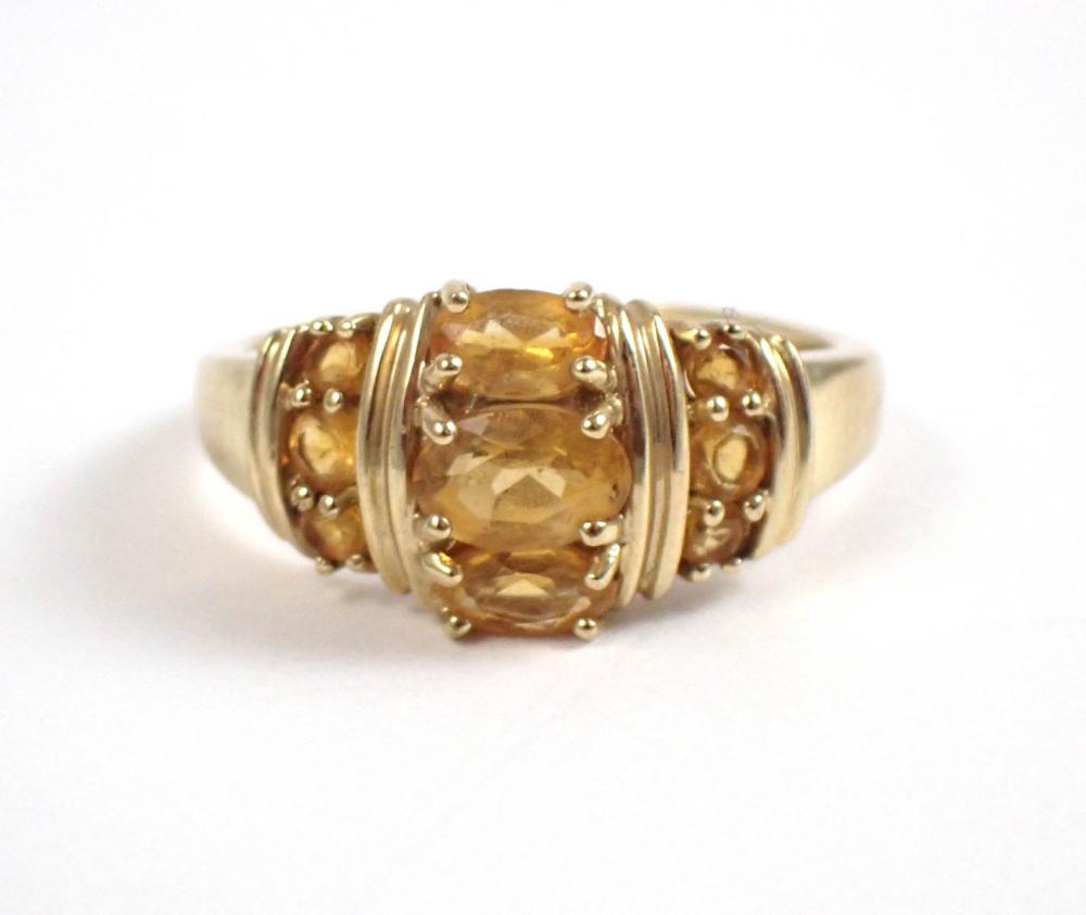 Appraisal: CITRINE AND TEN KARAT YELLOW GOLD RING set with six