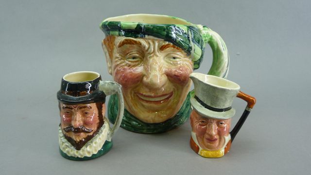 Appraisal: Three Character Jugs by Lancaster Sandland the larger titled Scottie