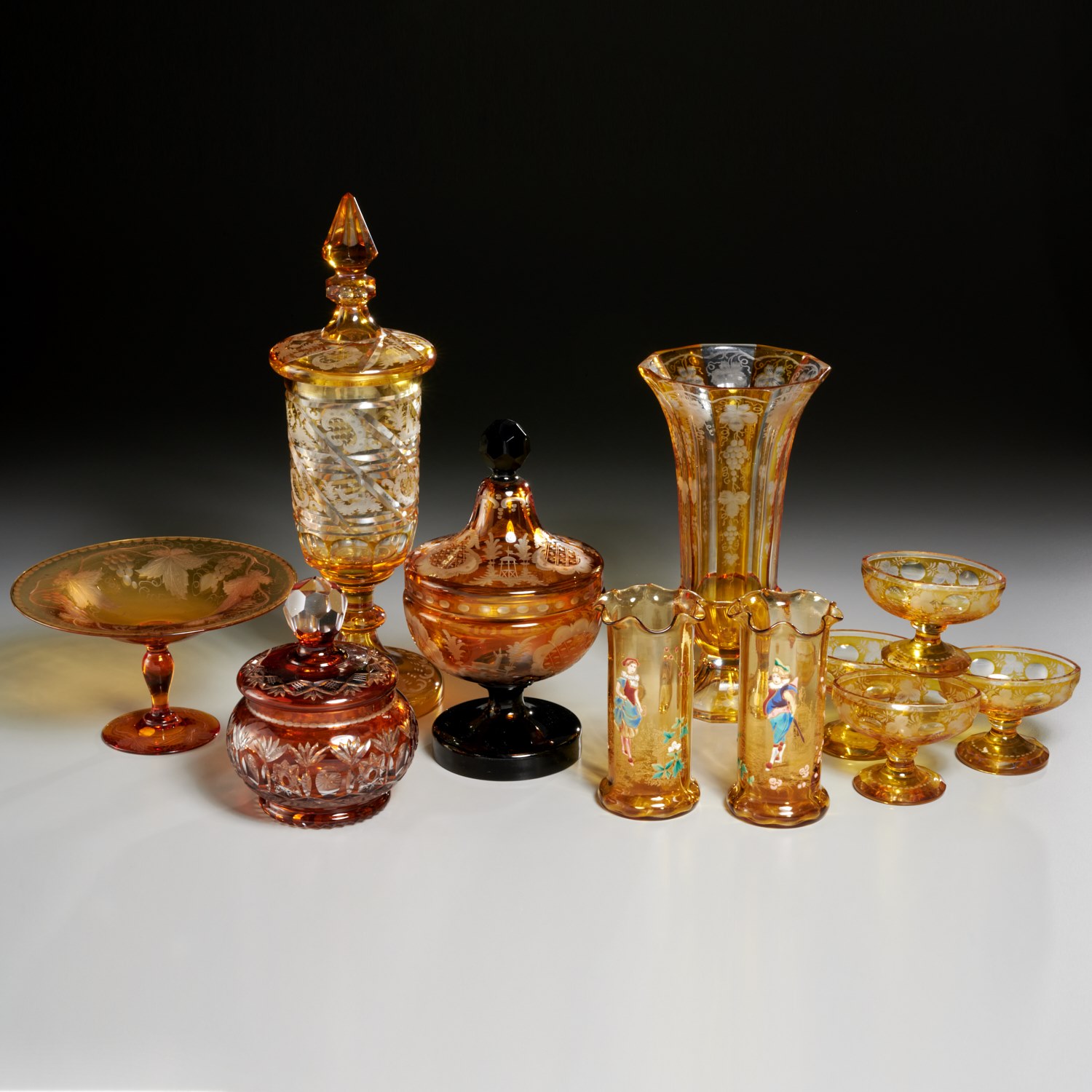 Appraisal: LOVELY COLLECTION BOHEMIAN AMBER GLASS th th c pieces etched