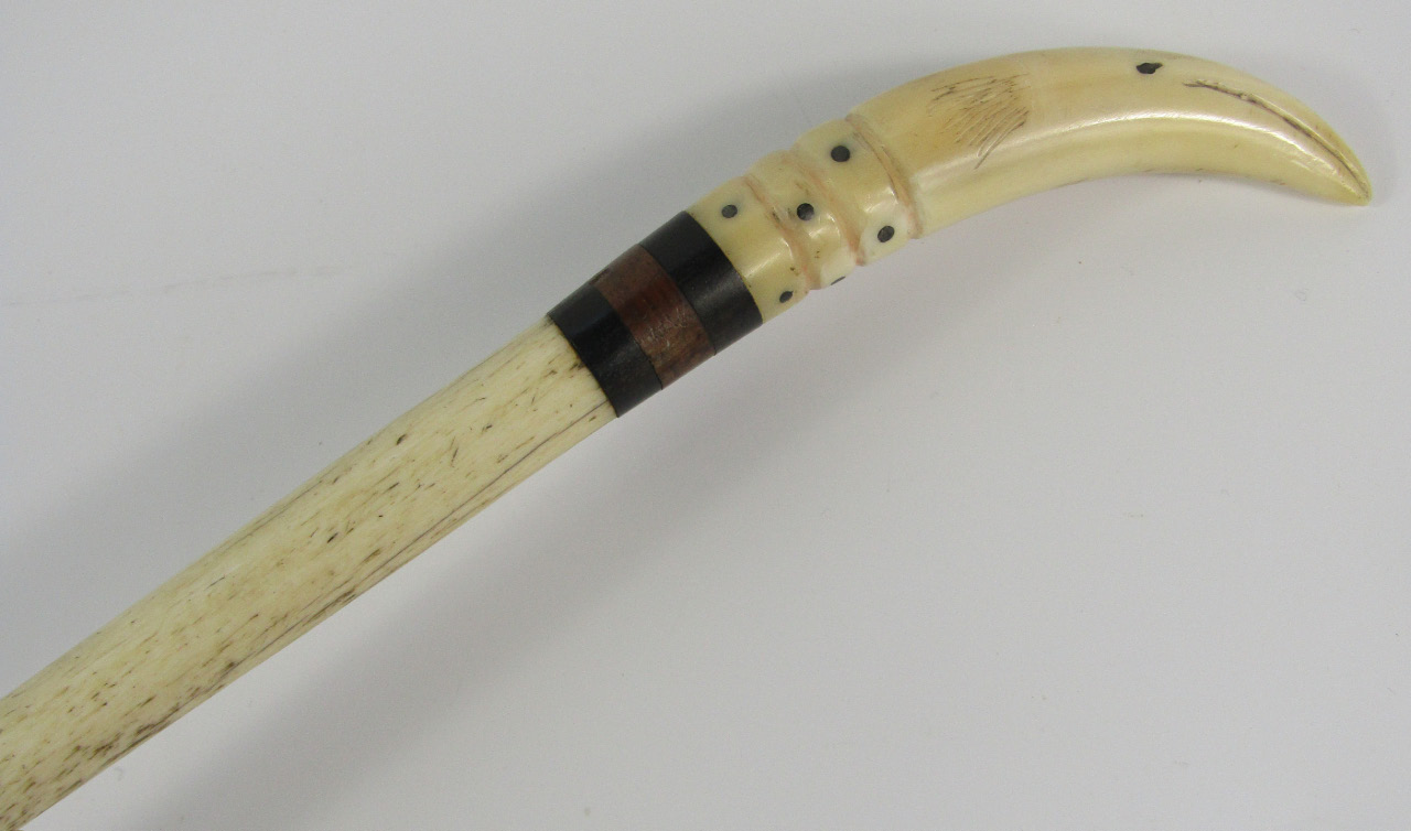 Appraisal: A marine ivory and banded walking cane carved with the