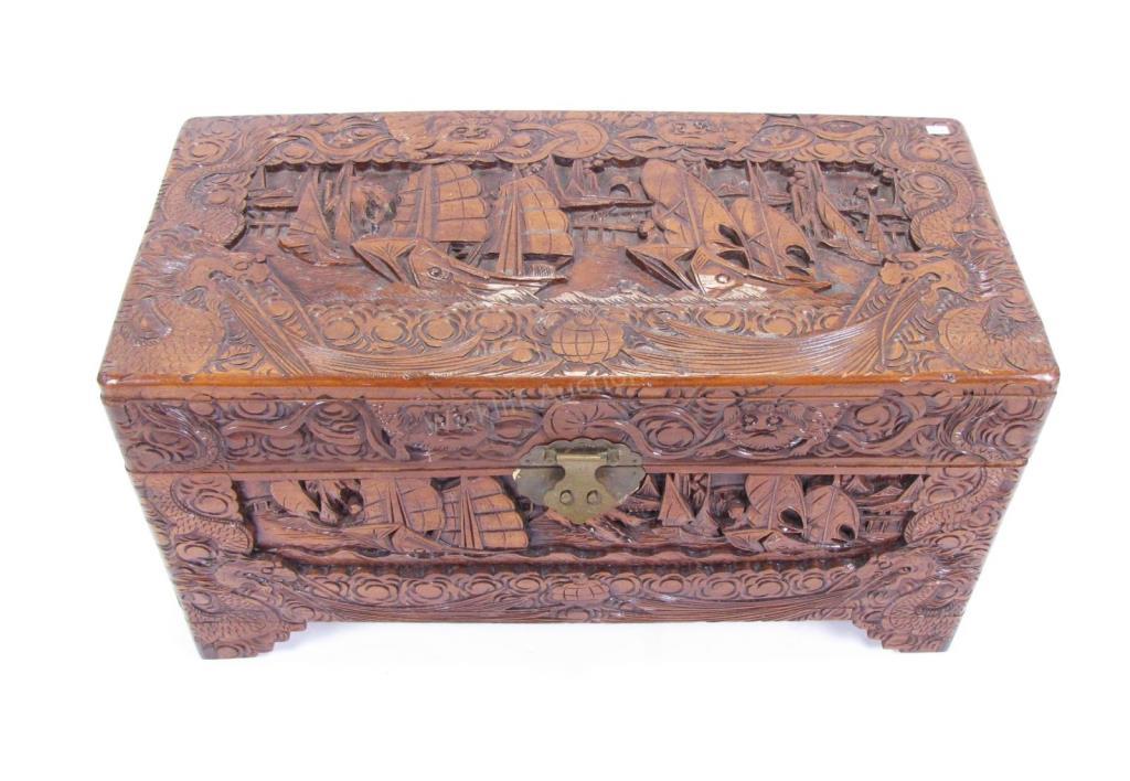 Appraisal: A recess-carved Oriental trunk with nautical and dragon motif carvings