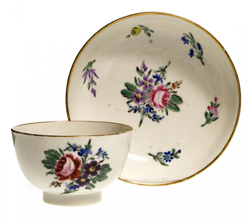 Appraisal: A FIRST PERIOD WORCESTER TEA BOWL AND SAUCER enamelled with