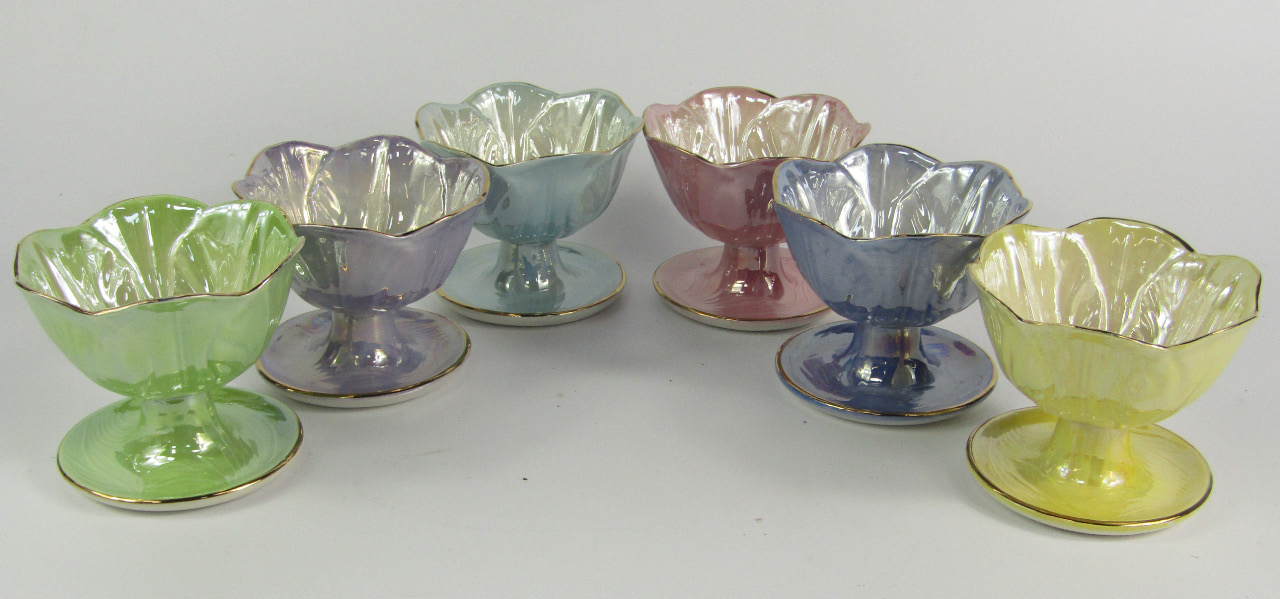 Appraisal: A set of six Maling vari coloured lustre leaf moulded