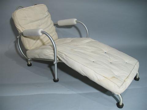 Appraisal: WARREN MCARTHUR ALUMINUM CHAISE LOUNGE Twentieth century with loose cushions