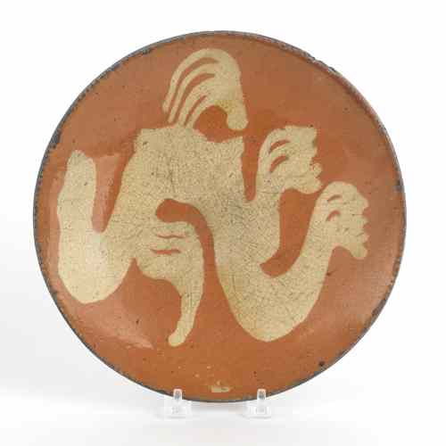 Appraisal: Pennsylvania redware plate th c with yellow slip decoration dia