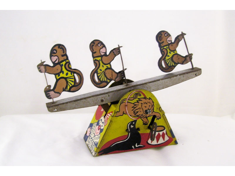 Appraisal: Lewco Mechanical Circus Monkey Tin litho windup toy with three