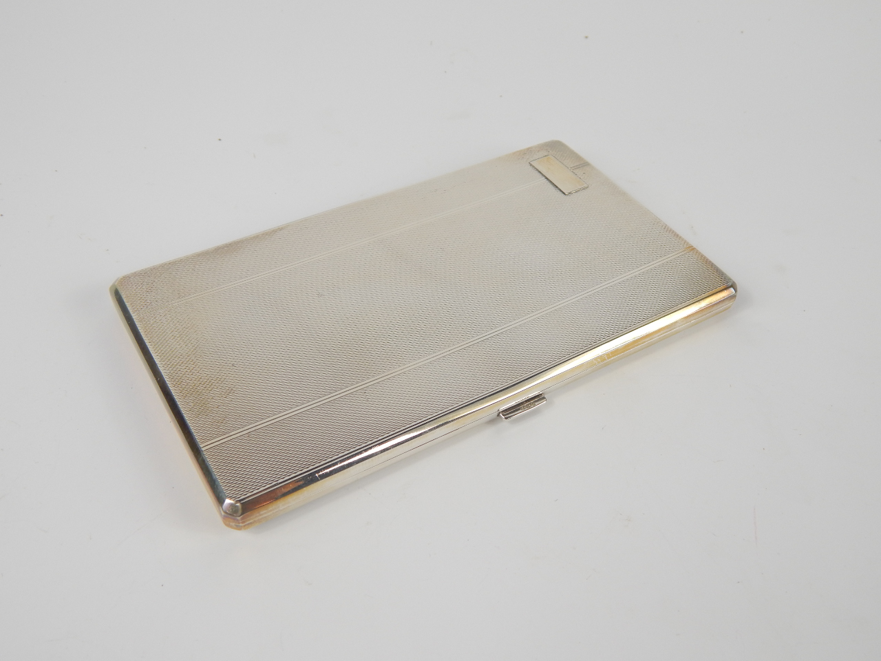 Appraisal: A George VI silver cigarette case with engine turned decoration