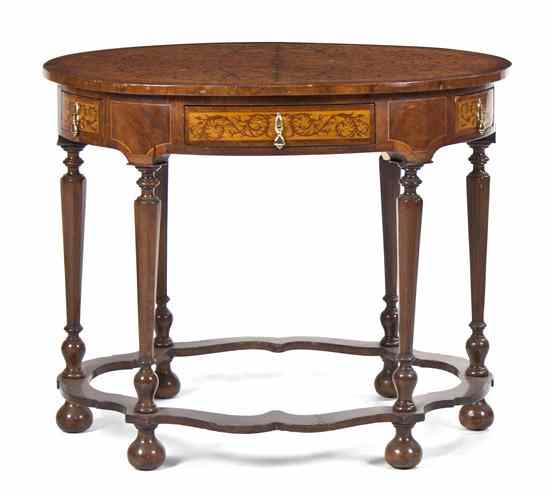 Appraisal: A Continental Marquetry Occasional Table the oval top decorated with