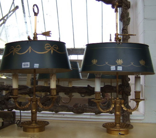 Appraisal: A pair of tole pente and brass bouillotte table lamps