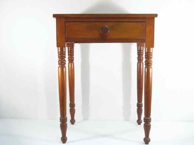 Appraisal: A small maple finished one-drawer stand in the manner of