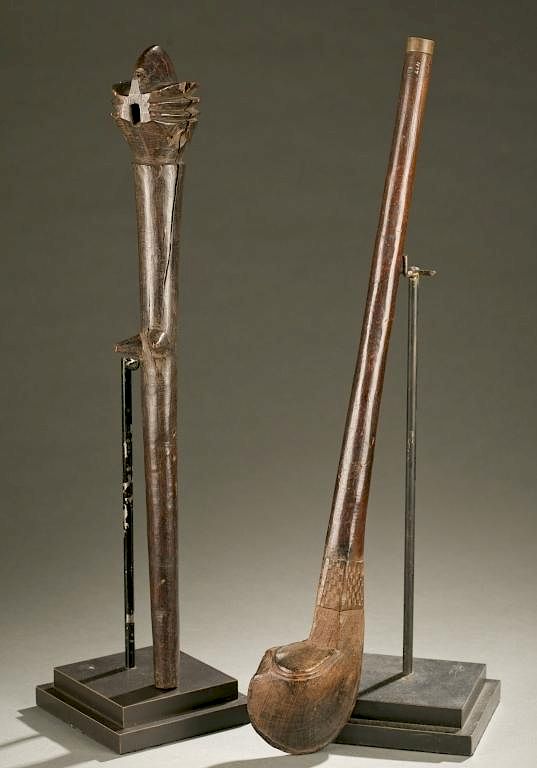 Appraisal: African axe and club th century An axe handle and