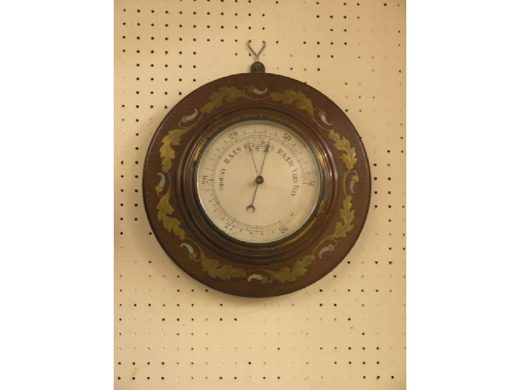 Appraisal: An early th century mahogany and brass-inlaid aneroid barometer circular-shape