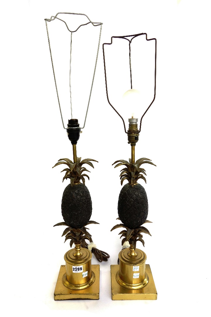 Appraisal: A pair of gilt and patinated brass table lamps late