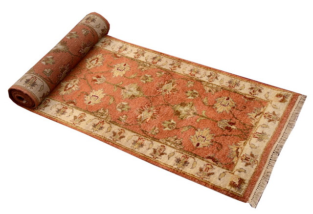 Appraisal: A MODERN ZIEGLER RUST GROUND RUNNER with foliate decoration and