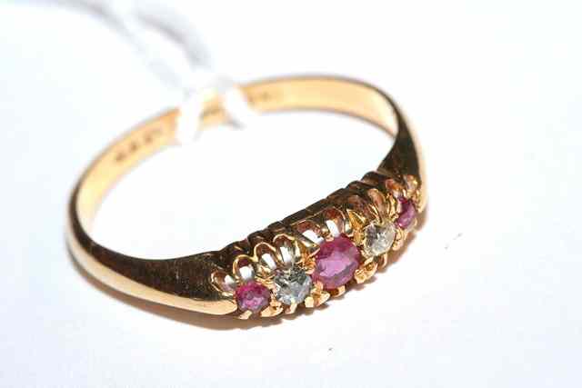 Appraisal: A FIVE STONE RUBY AND DIAMOND SET DRESS RING three