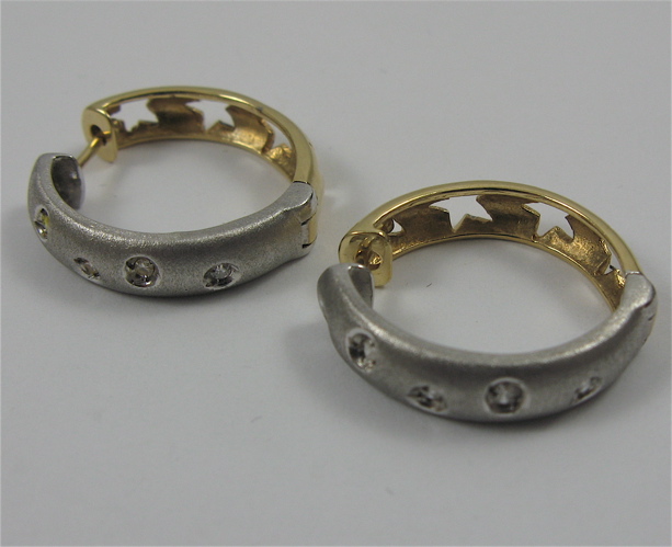 Appraisal: PAIR OF DIAMOND AND K GOLD HOOP EARRINGS Each is