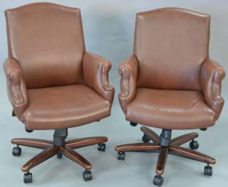 Appraisal: Pair of Cabot Wrenn leather armchairs having swivel bases Pair