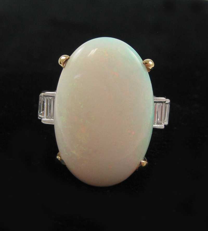 Appraisal: OPAL DIAMOND AND FOURTEEN KARAT GOLD RING The white and