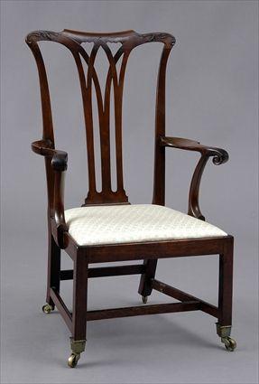 Appraisal: GEORGE III MAHOGANY ARMCHAIR The shaped rail above a fluted