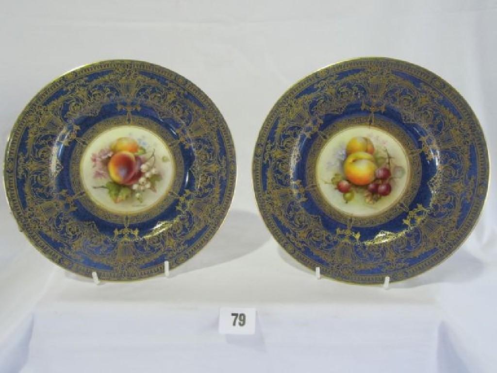 Appraisal: Two Royal Worcester plates hand painted by R Sebright on