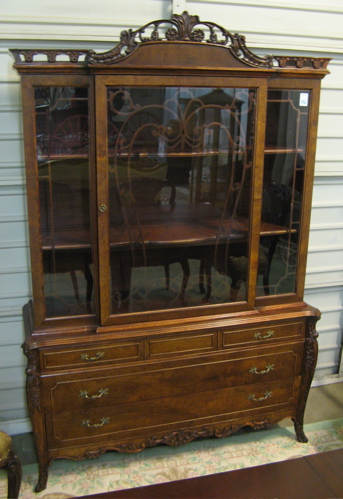 Appraisal: LOUIS XV STYLE CHINA CABINET ON BUFFET American c 's