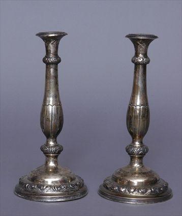 Appraisal: PAIR OF CONTINENTAL SILVER TABLE CANDLESTICKS With part reeded pear