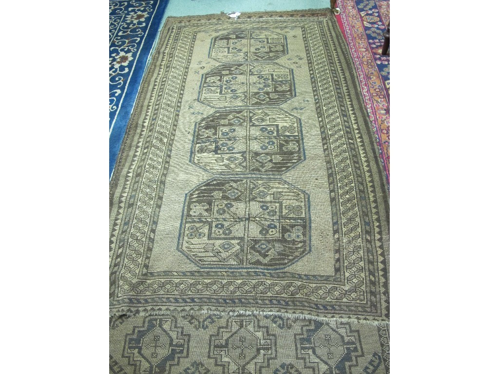 Appraisal: Two Eastern floor rugs on brown grounds Provenance The Property