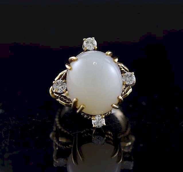 Appraisal: Gold Moonstone Diamond Ring Yellow gold cocktail ring set with