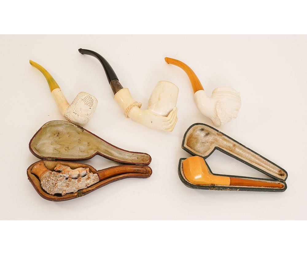 Appraisal: Four Meerschaum Pipes etc Four carved Meerschaum smoking pipes late