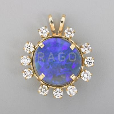 Appraisal: BLACK OPAL AND DIAMOND PENDANT Circular k yg pendant supports