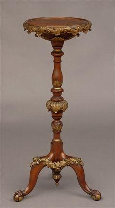 Appraisal: GEORGE II-STYLE CARVED WALNUT AND PARCEL-GILT TORCHERE The top with