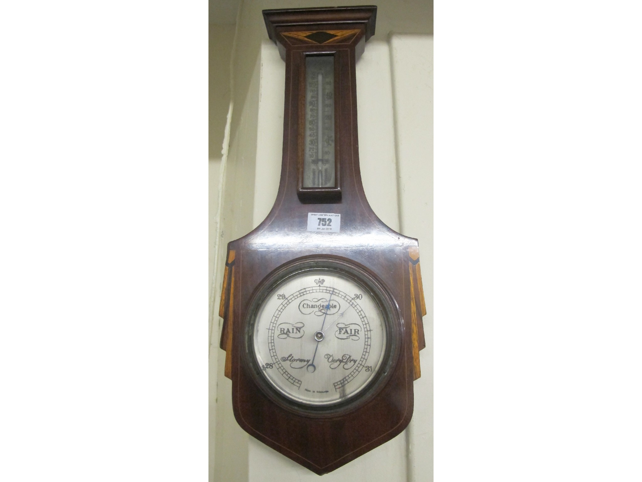 Appraisal: An Edwardian mahogany inlaid barometer and thermometer