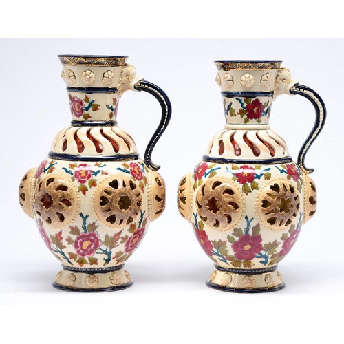 Appraisal: A pair of Fischer double walled reticulated ewers late th