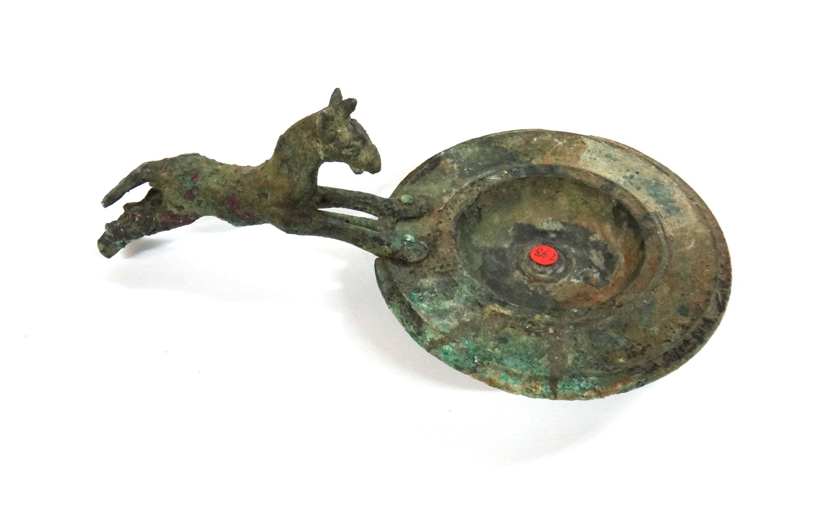 Appraisal: A Luristan bronze oil lamp the handle in the form