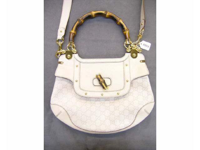 Appraisal: Gucci handbag with ivory leather Gucci logo bamboo handle with