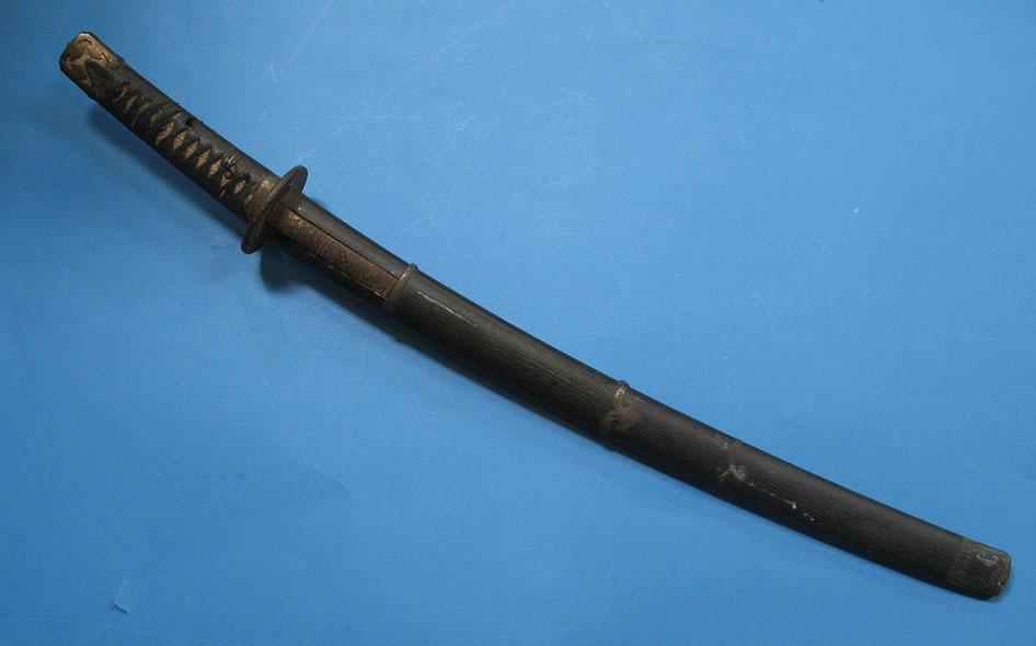 Appraisal: A JAPANESE SWORD with a curved steel blade an iron