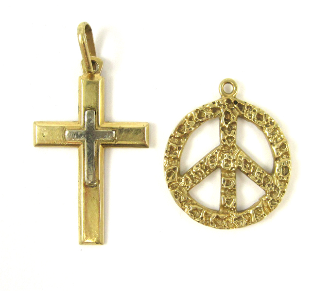 Appraisal: TWO FOURTEEN KARAT GOLD CHARMS including a yellow gold peace