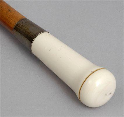 Appraisal: IVORY-HANDLED FRUITWOOD WALKING STICK The handle with twist-off cap opening