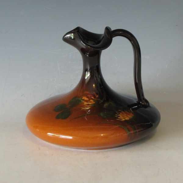 Appraisal: Weller Louwelsa standard glaze trefoil ewer with clover decoration Initialed