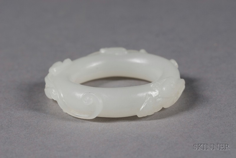 Appraisal: Jade Ring China th th century white stone surface carved