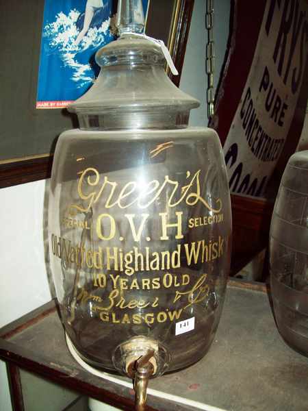 Appraisal: A LATE VICTORIAN 'GREER'S' GLASS WHISKY BARREL WITH A BRASS