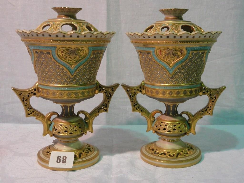 Appraisal: A pair of Royal Worcester two handled vases and covers